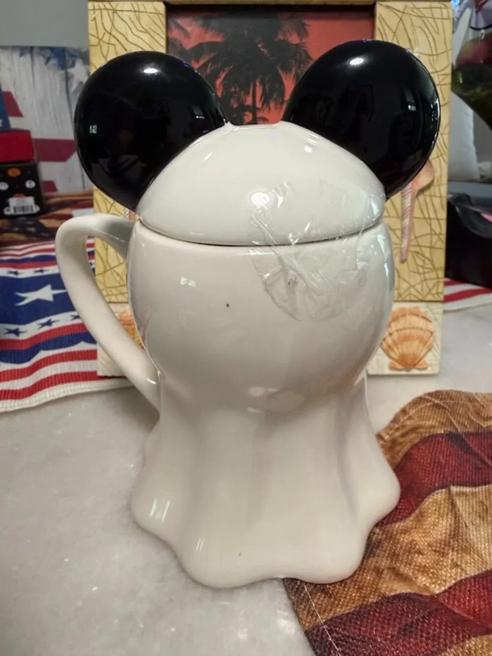 This Disney Mickey Mouse Ghost Coffee Mug with Ears Lid is a unique and fun